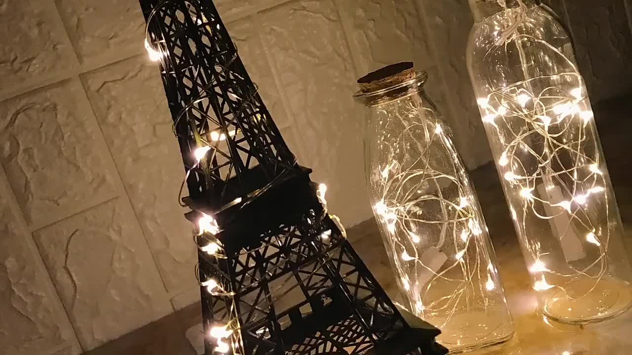 One strand of Sparkle Ribbon lights this entire Eiffel Tower vase. Battery  operated and small pa…