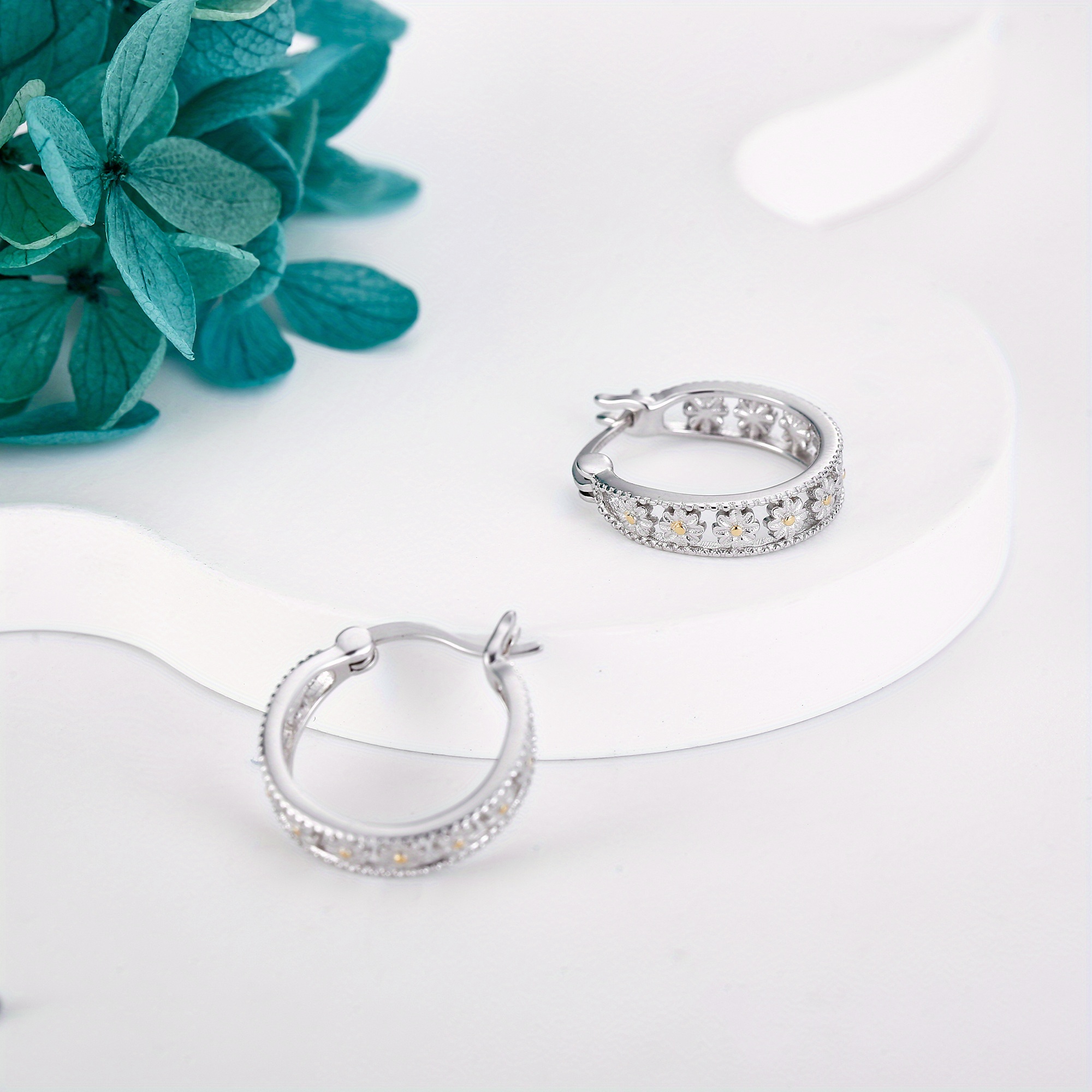 pair of elegant daisy earrings in 925 sterling silvery classic   with sparkling accents   daily wear or gifting gift   elegant style detailed   Product details 0