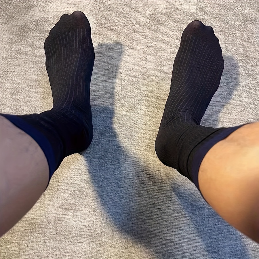 Men's Hairy Legs In Striped Socks, Top View Stock Photo, Picture