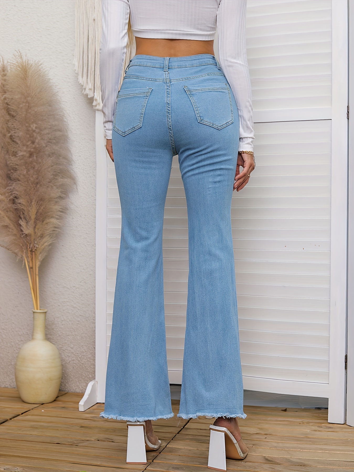 High Waisted Light Wash Raw Hem Cropped Flare Jeans