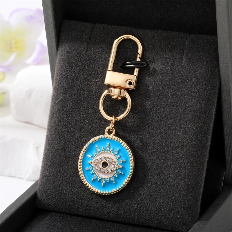 NBEADS 10 Pcs Evil Eye Keychain, Turkish Blue Eye Key Chain Charms Resin  Eye Pendant Hanging Ornament for Bag Phone Car Wallet Lanyard Party Favors