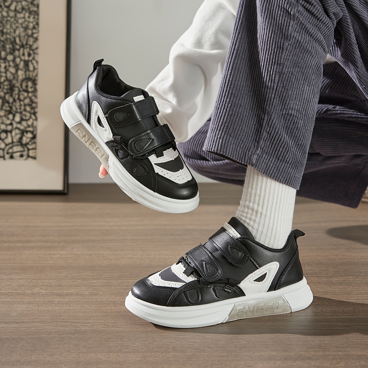 White velcro strap low cut slip on rocker bottom sneaker