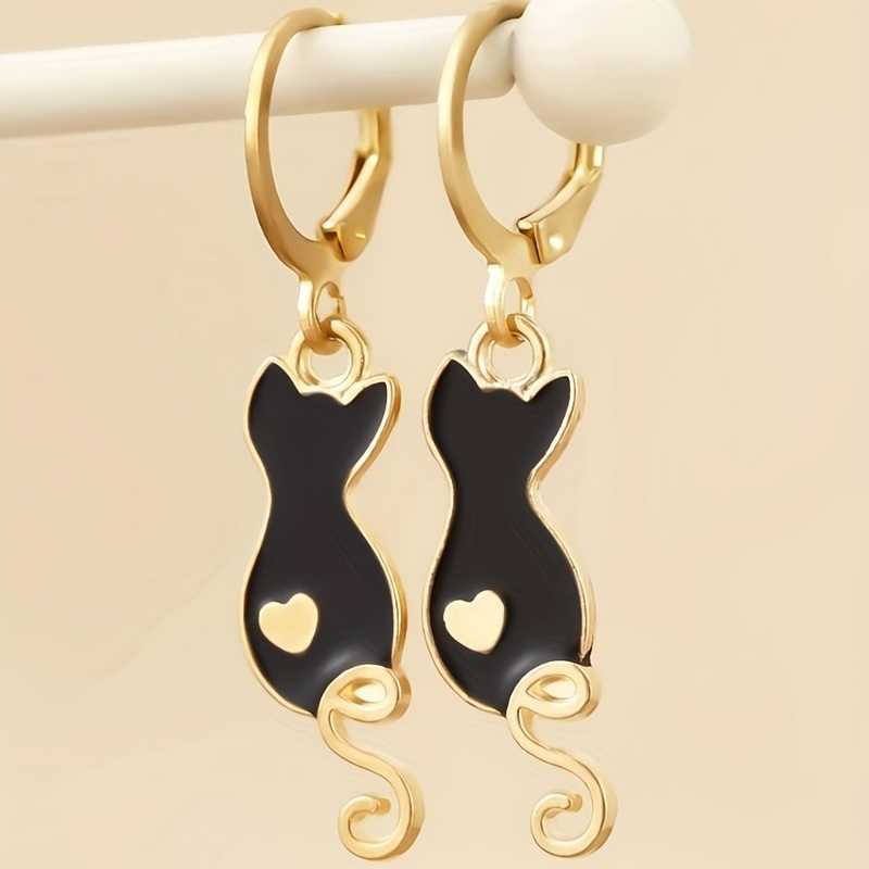 

Une paire de boucles d'oreilles mignonnes en de goutte d'huile de dessin pour chat.