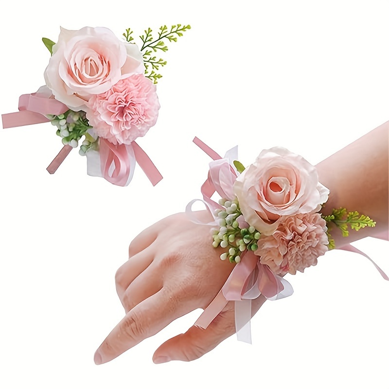 Hand deals wrist corsage