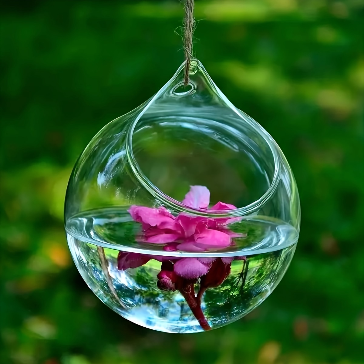 Vase boule en verre, billes d'eau, Leds roses et marguerites.