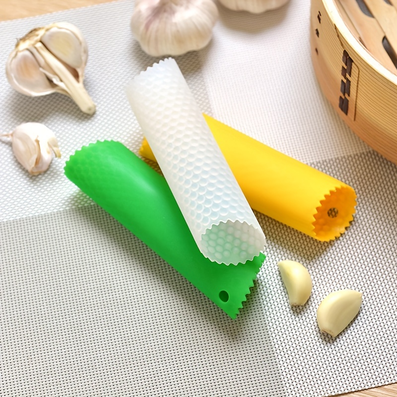 1 pelador de ajos de silicona. El pelador de ajos es fácil de pelar  rápidamente. Los dientes de ajo son utensilios de cocina prácticos e  inodoros oso de fresa Electrónica