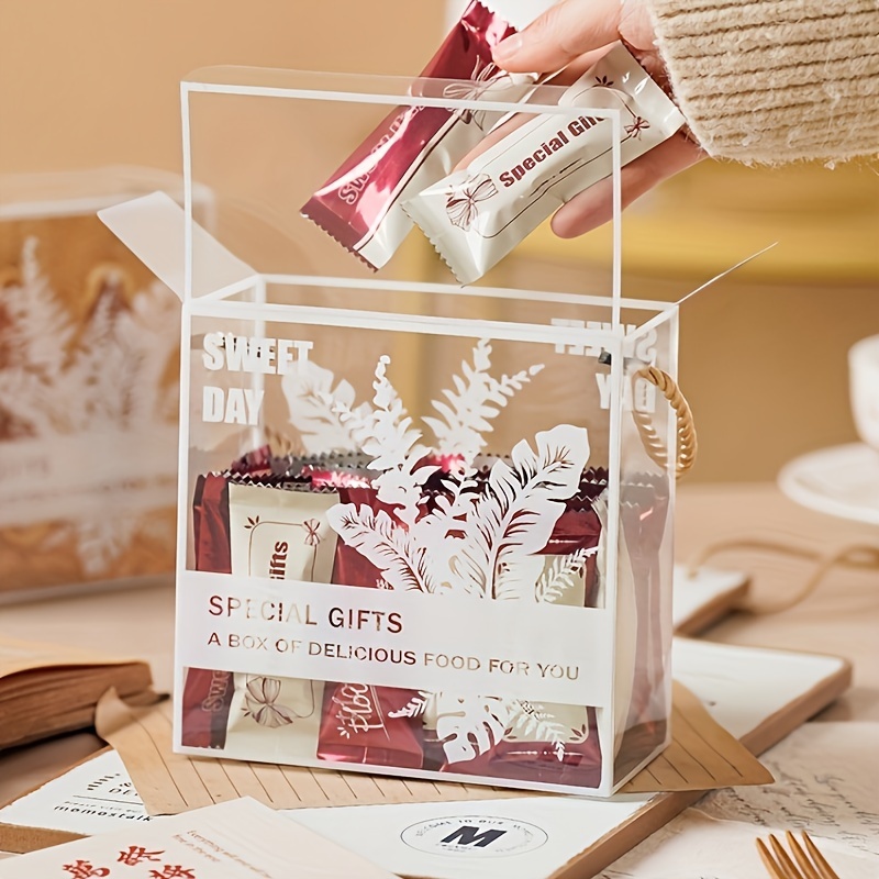 Craft gift box on wooden table with raffia or twine — Stock Photo ©  279photo.gmail.com #106548806