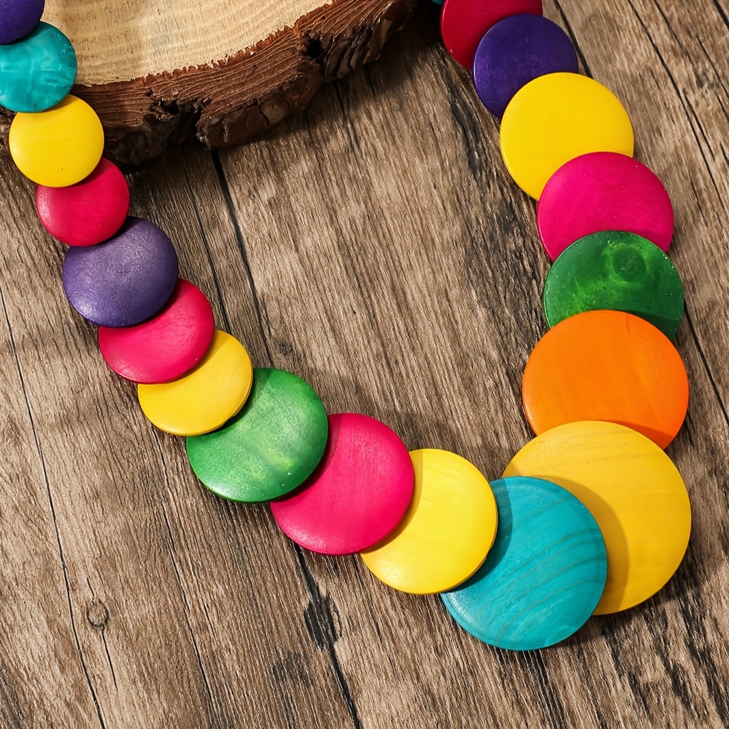 A Handcrafted Wooden Bohemian Beaded Necklace In Various