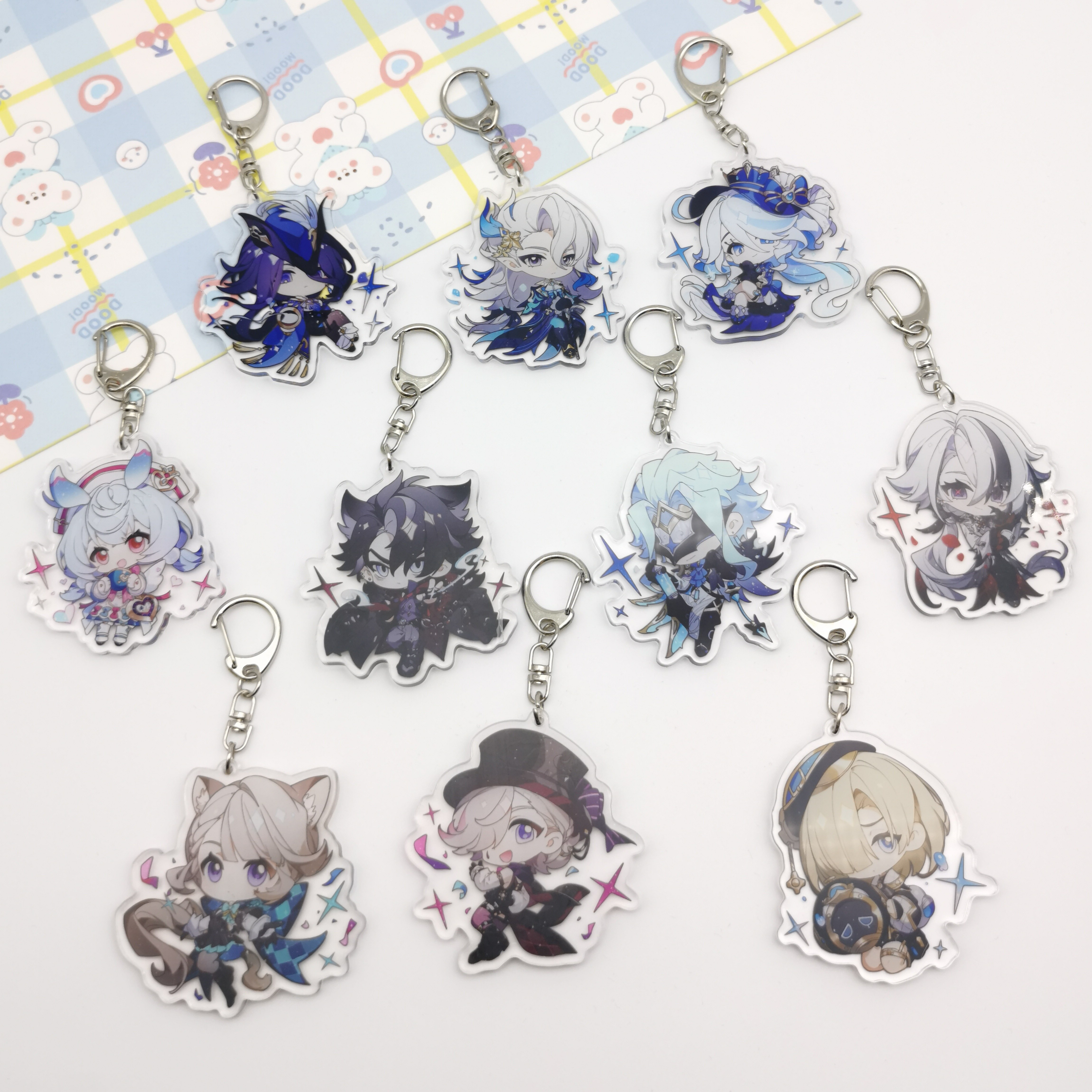 Do acrylic charms have protective film and/or laminate?