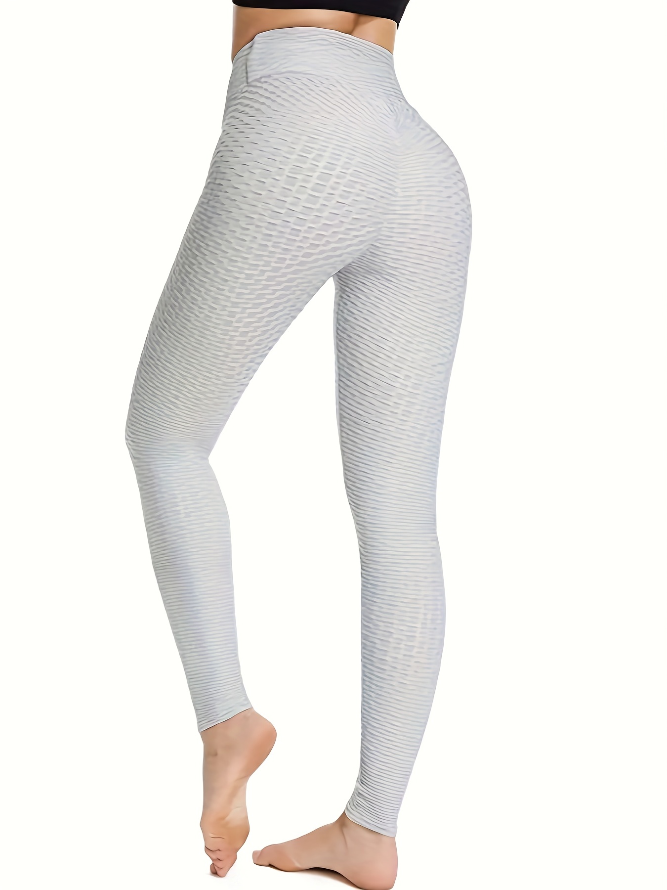 Premium AI Image  Vibrant Front View of White Carbon Fiber Yoga Pants with  Colorful Electrical Accents No Background