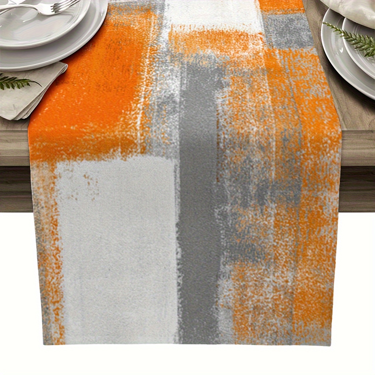 

Table runner with a modern abstract art design in grey and orange, perfect for adding a touch of style to your dining table or dresser. Ideal for holiday parties and banquet decorations.