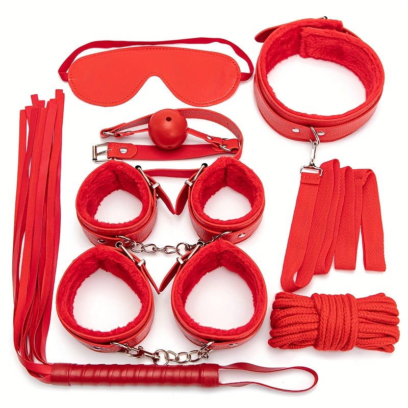 Female in BDSM Sexy Lingerie Posing with Rope Accessories for BDSM Play. In  red Handcuffs and Net Pantyhose. Stock Photo