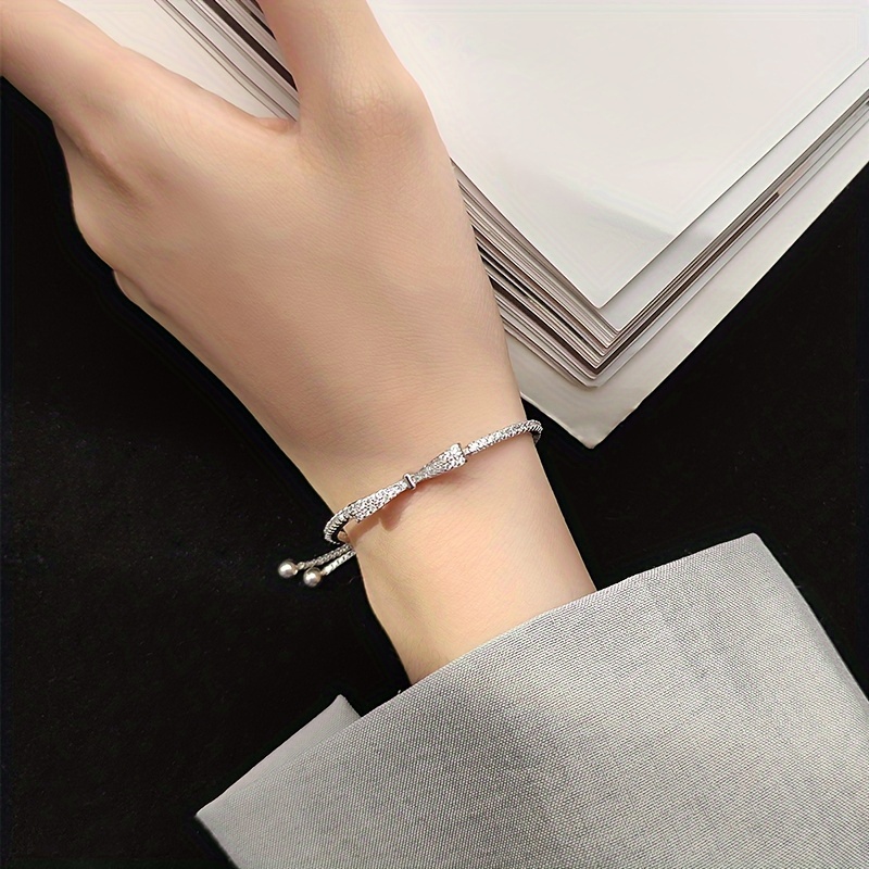 Sterling Silver Bow Bracelet CZ December Birthstone