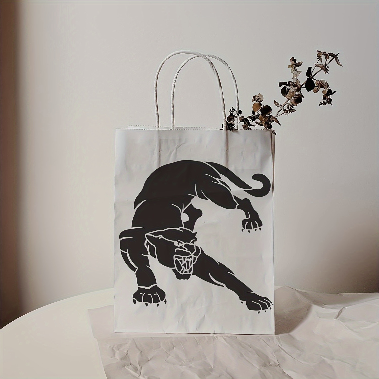 Godzilla goodie bags - black bags with spray painted stencil