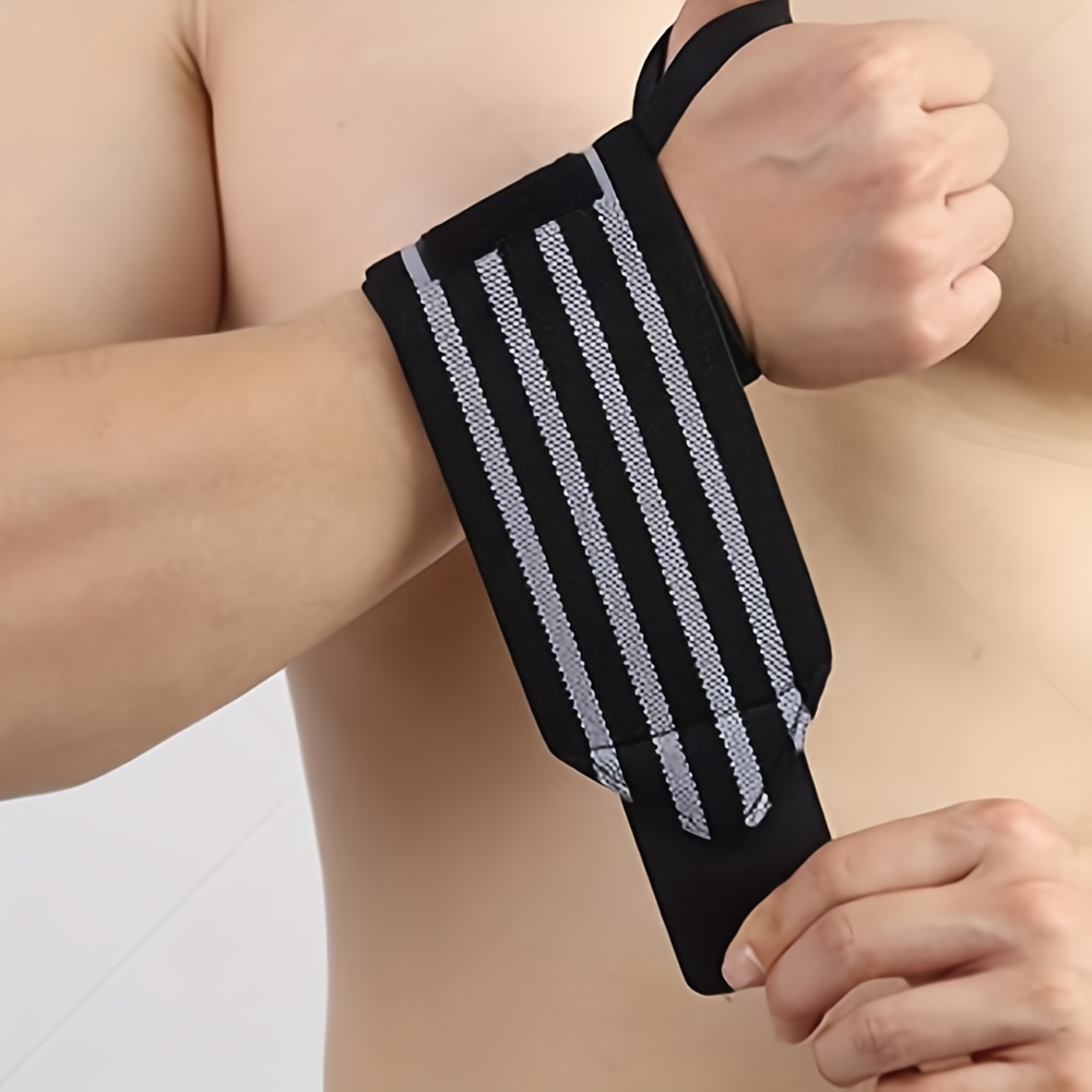 Une paire de ceinture de protection de poignet sport de compression de  poignet pour enfants (noir)