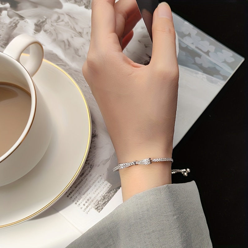 Sterling Silver Bow Bracelet CZ December Birthstone