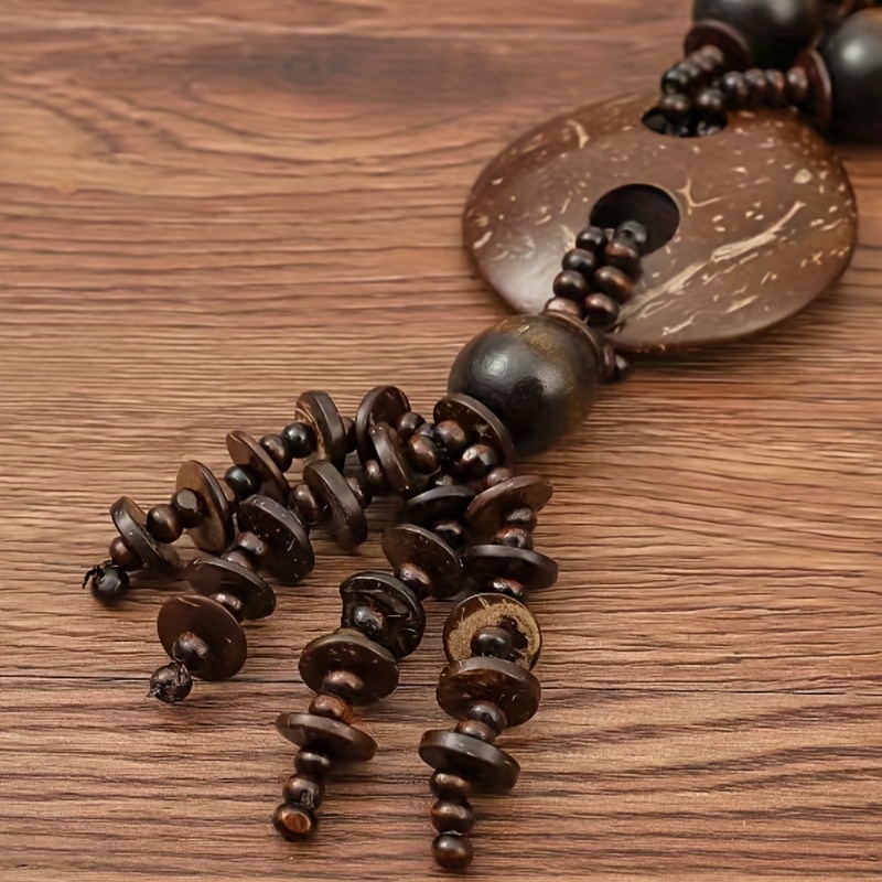 Large wooden beads with patterned shell detail