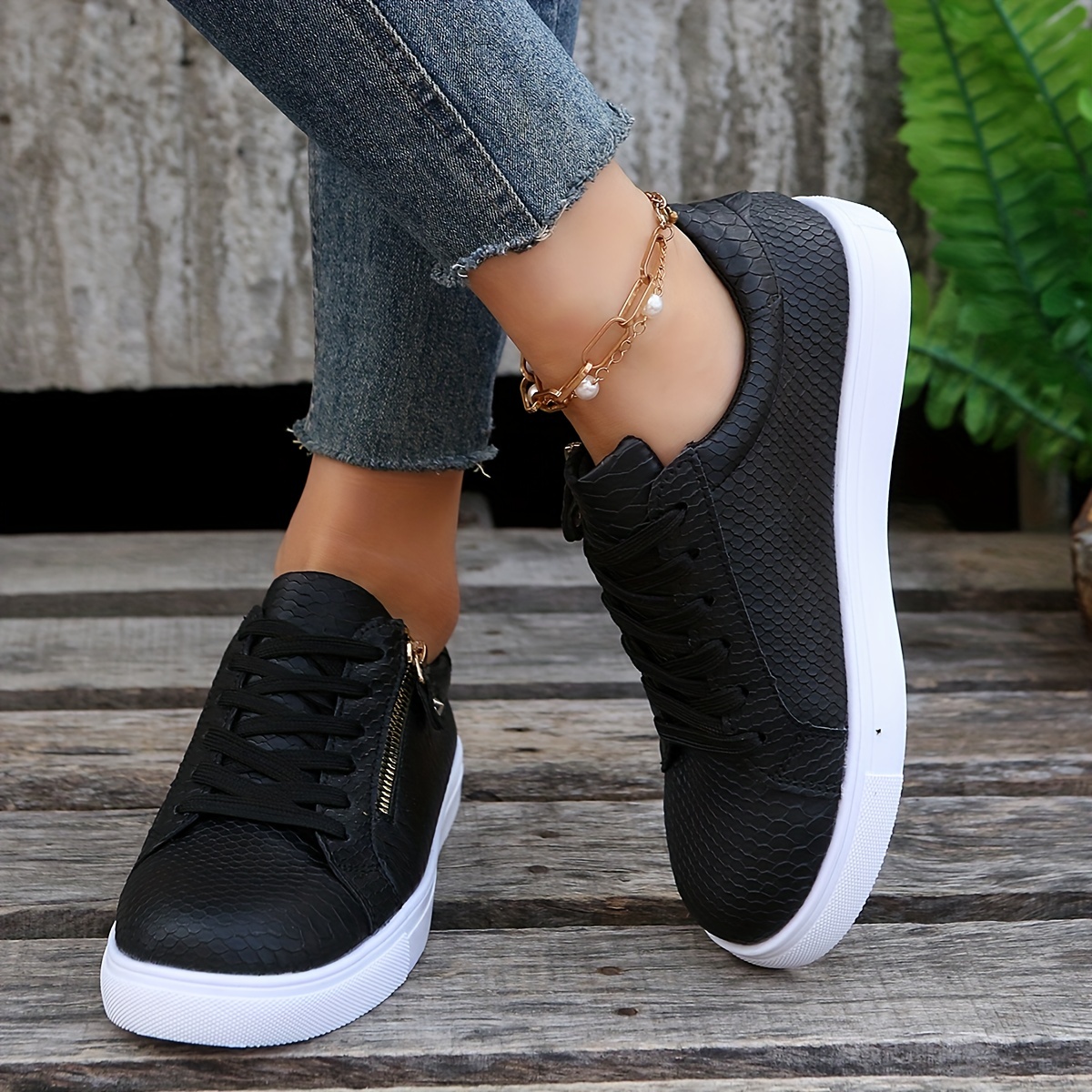 Black faux snake sales slip on trainers