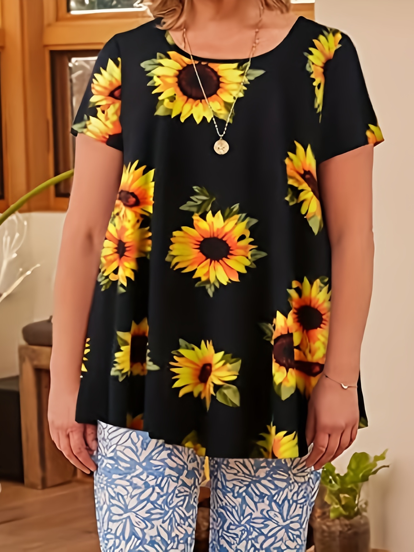 Plus size black sunflower print short sleeve tunic top