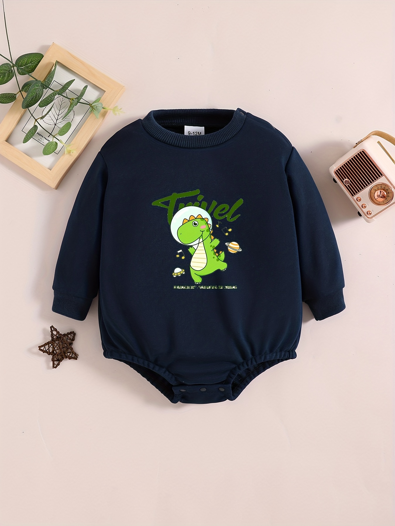 Long-sleeved jersey onesie with dinosaur print