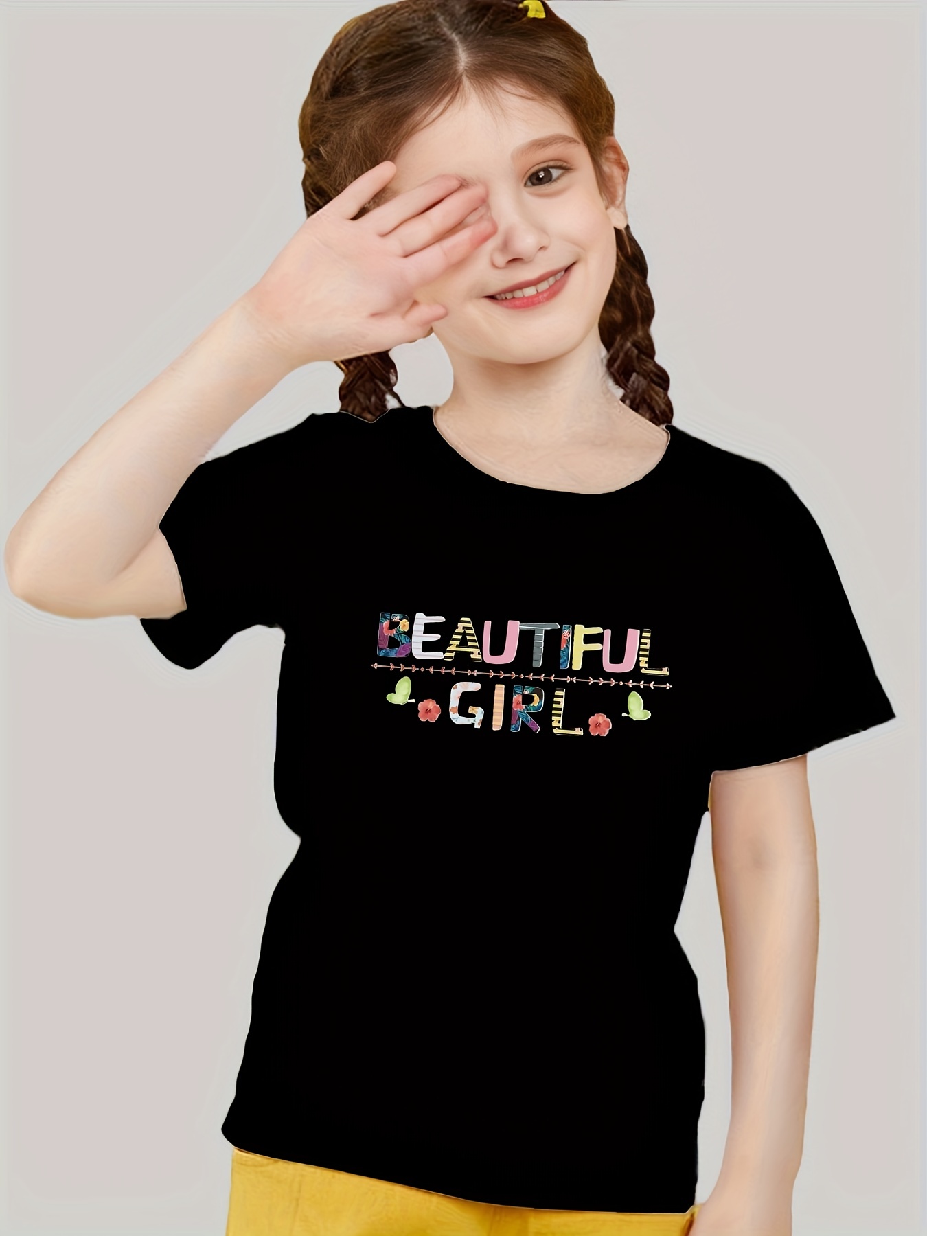 Beautiful little girl child in fashionable summer clothes with a