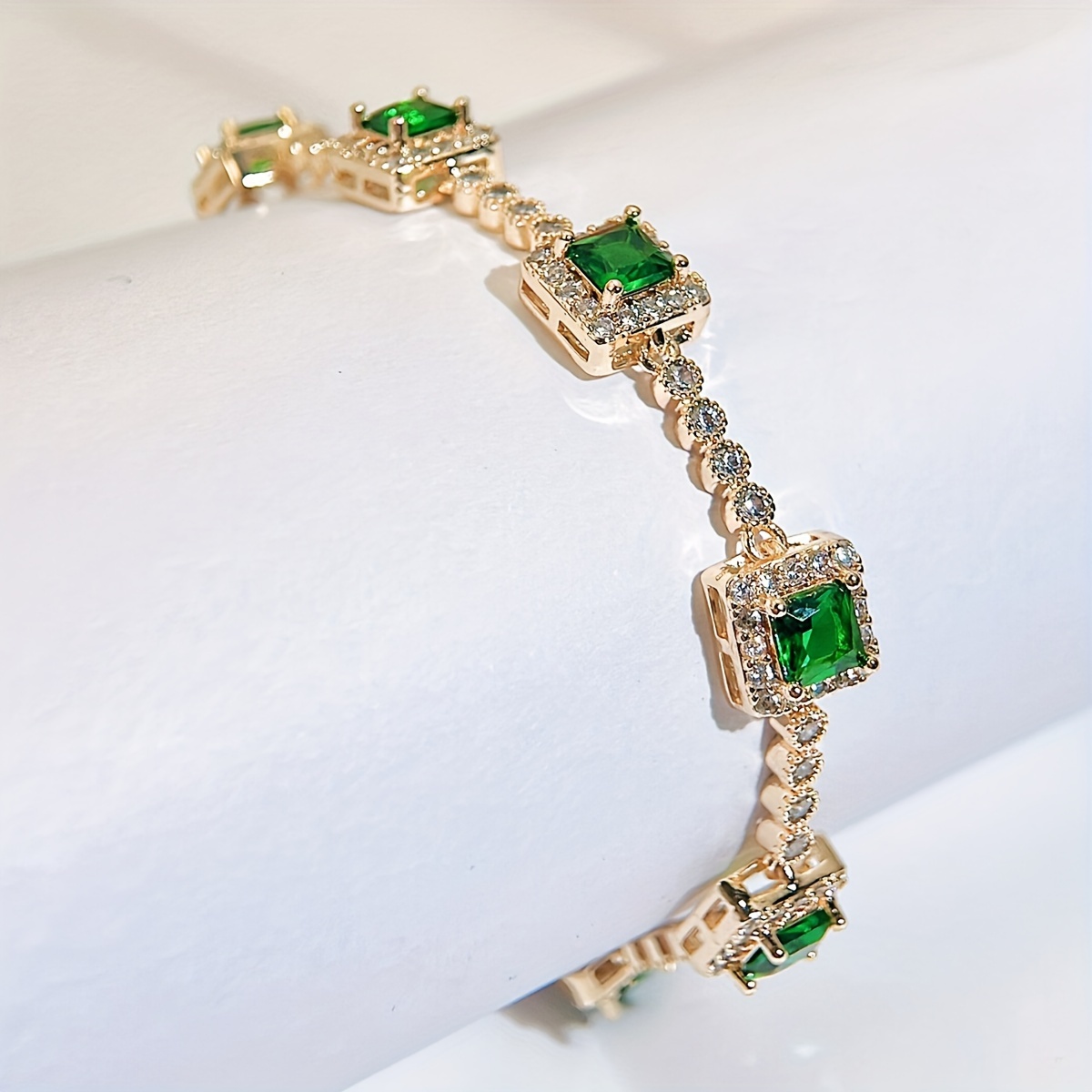 A Beautiful Green Cubic Zirconia Bracelet with a Silvery Golden Fashion Square Charm, Perfect for Women'S Evening Wear
