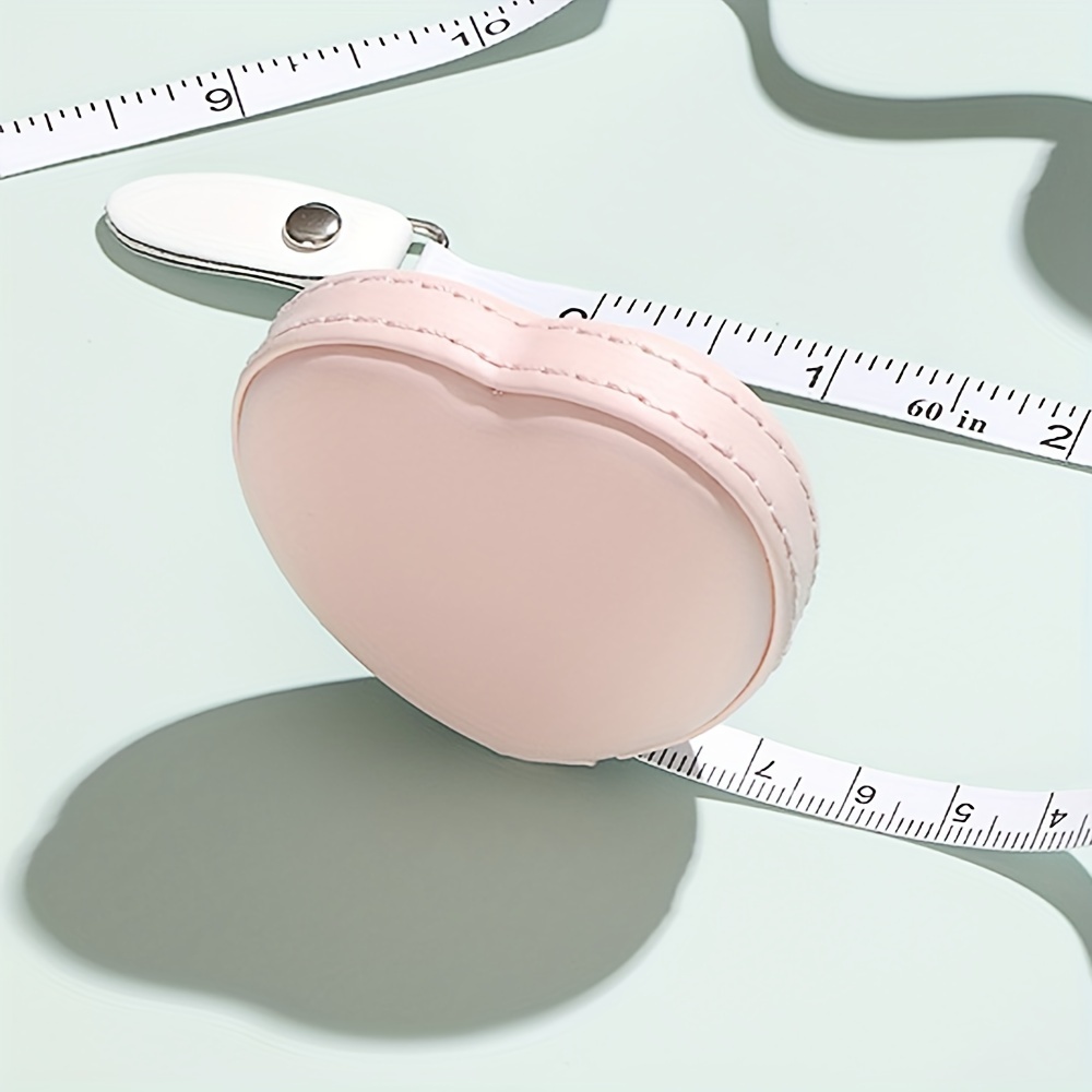 

1pc Heart Shaped Mini Tape Measure, Soft Ruler Portable Automatic Retractable Pull Ruler, Measuring Clothes Faux Leather Ruler 1.5m Length Ruler, Pu Material, Valentine's Day Gift, Home Supplies