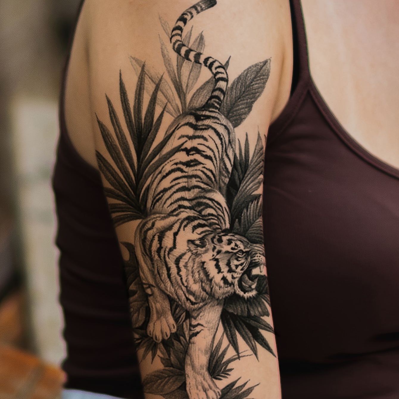Leaf tattoo on the left inner arm