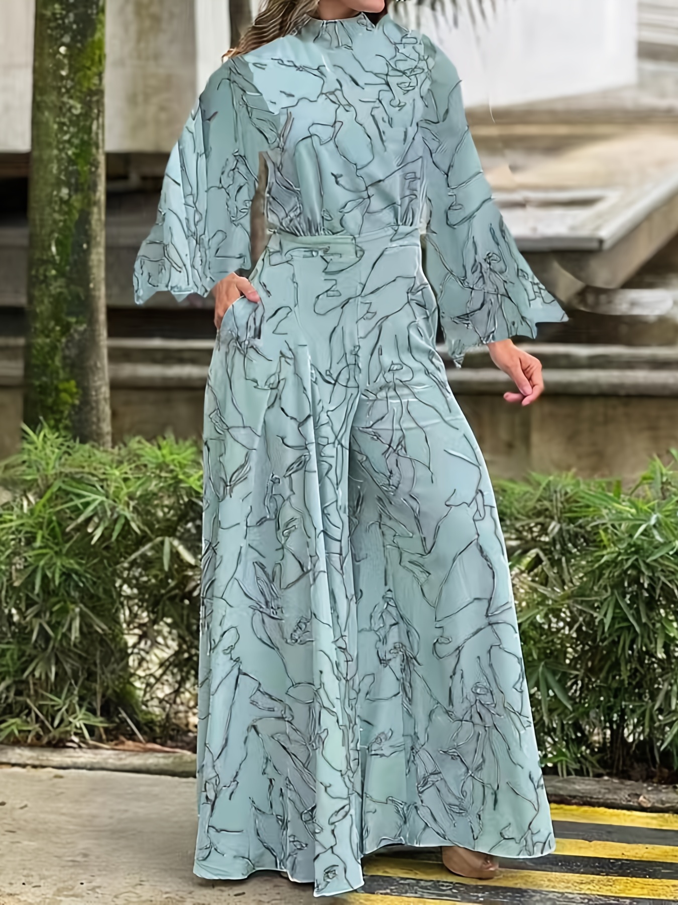 Black Floral Jumpsuit With Angel Sleeves - Sale from Yumi UK