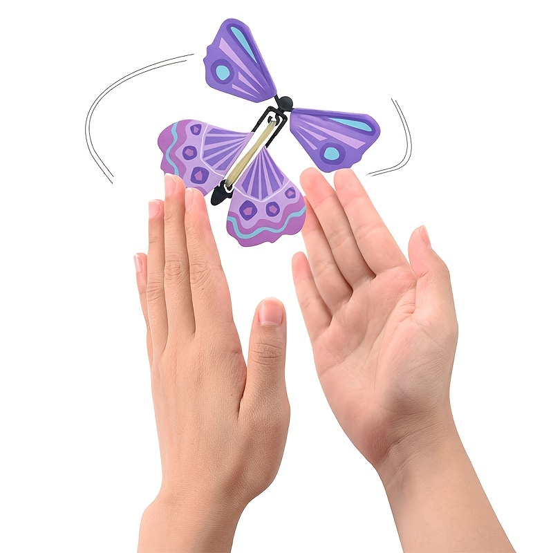 Mariposas voladoras voladoras, mariposa mágica voladora, cuerda sorpresa,  juguete mariposa voladora alimentado por banda goma, regalo divertido,  suministros fiesta, estilo aleatorio D/g : : Juguetes y Juegos