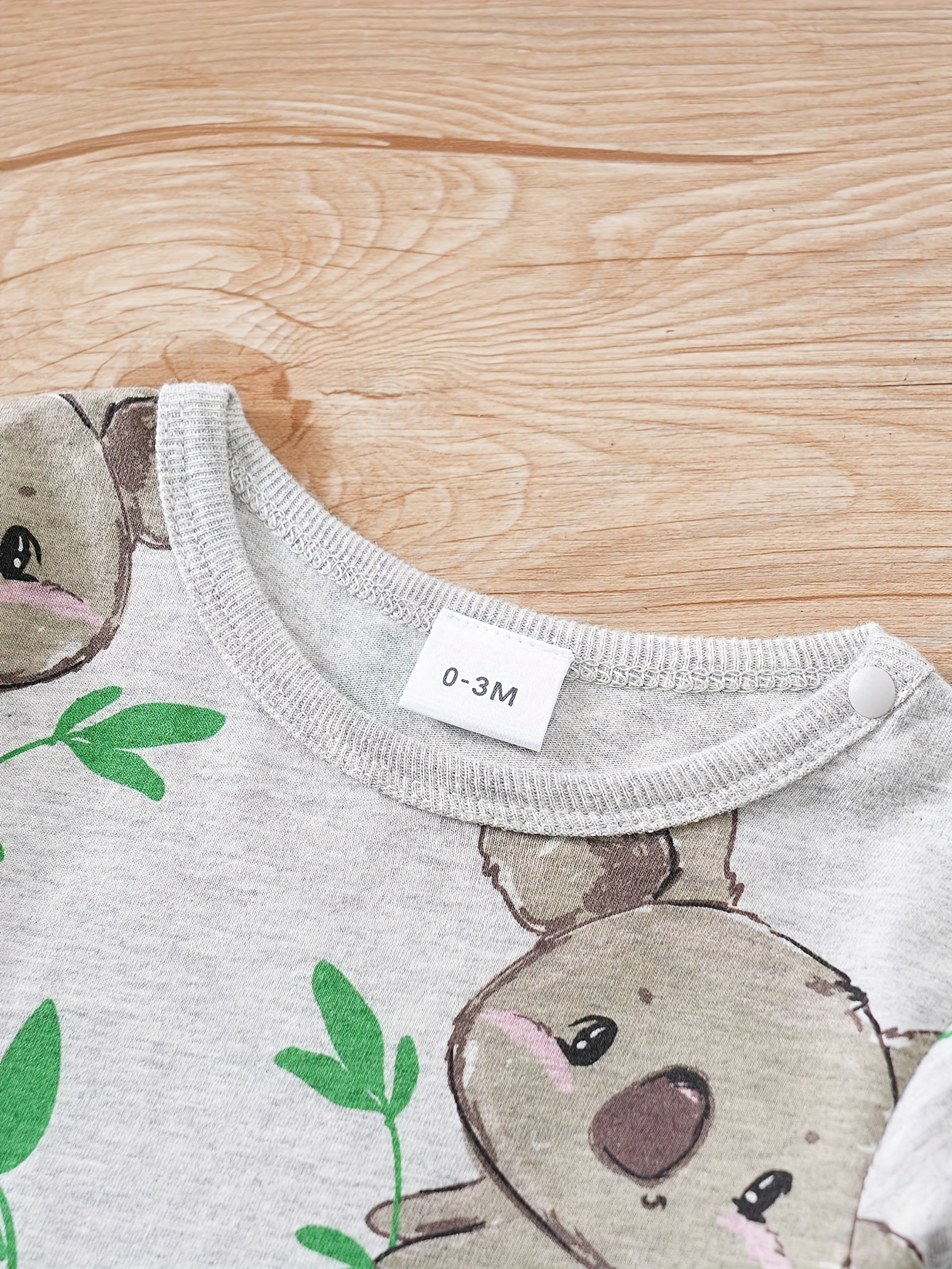 Camiseta manga corta negra para bebé diseño Koala