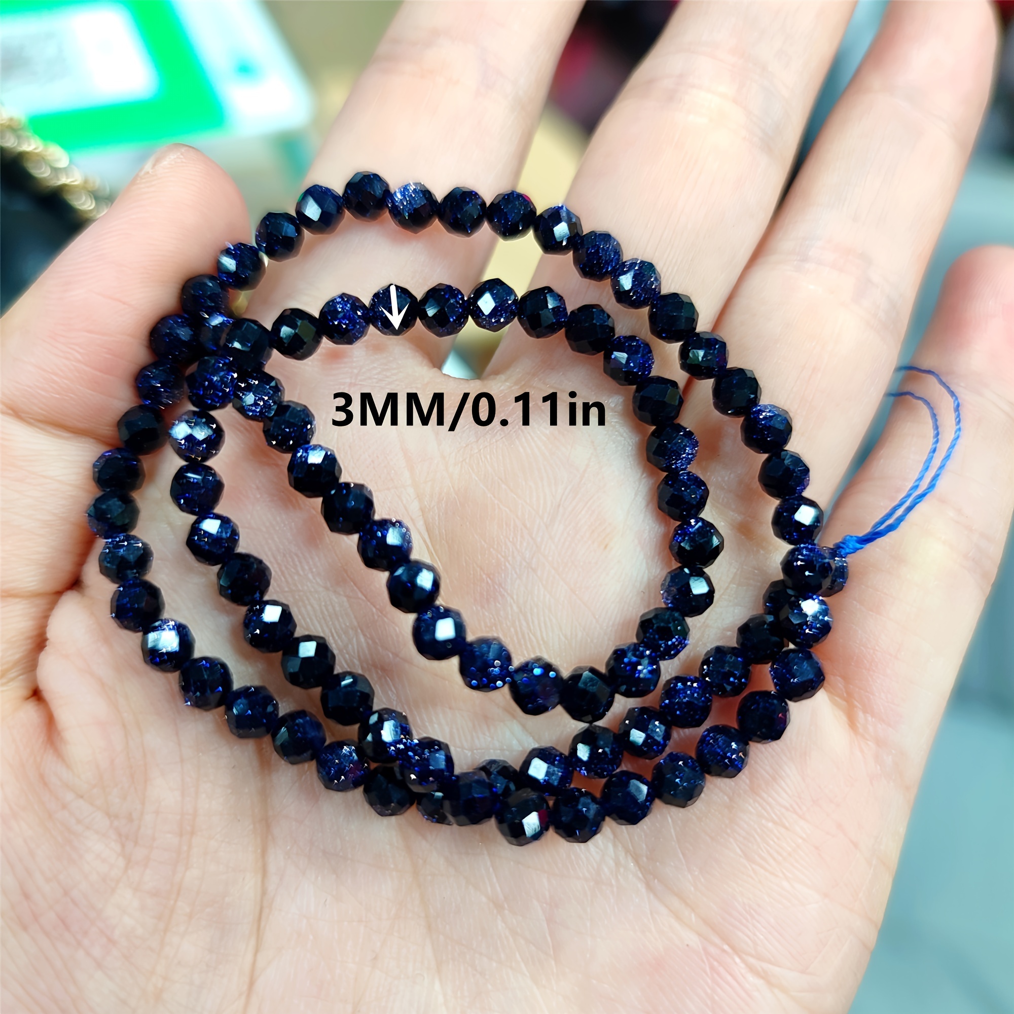 Faceted Natural Blue Sandstone Gemstone Round Loose Beads on a