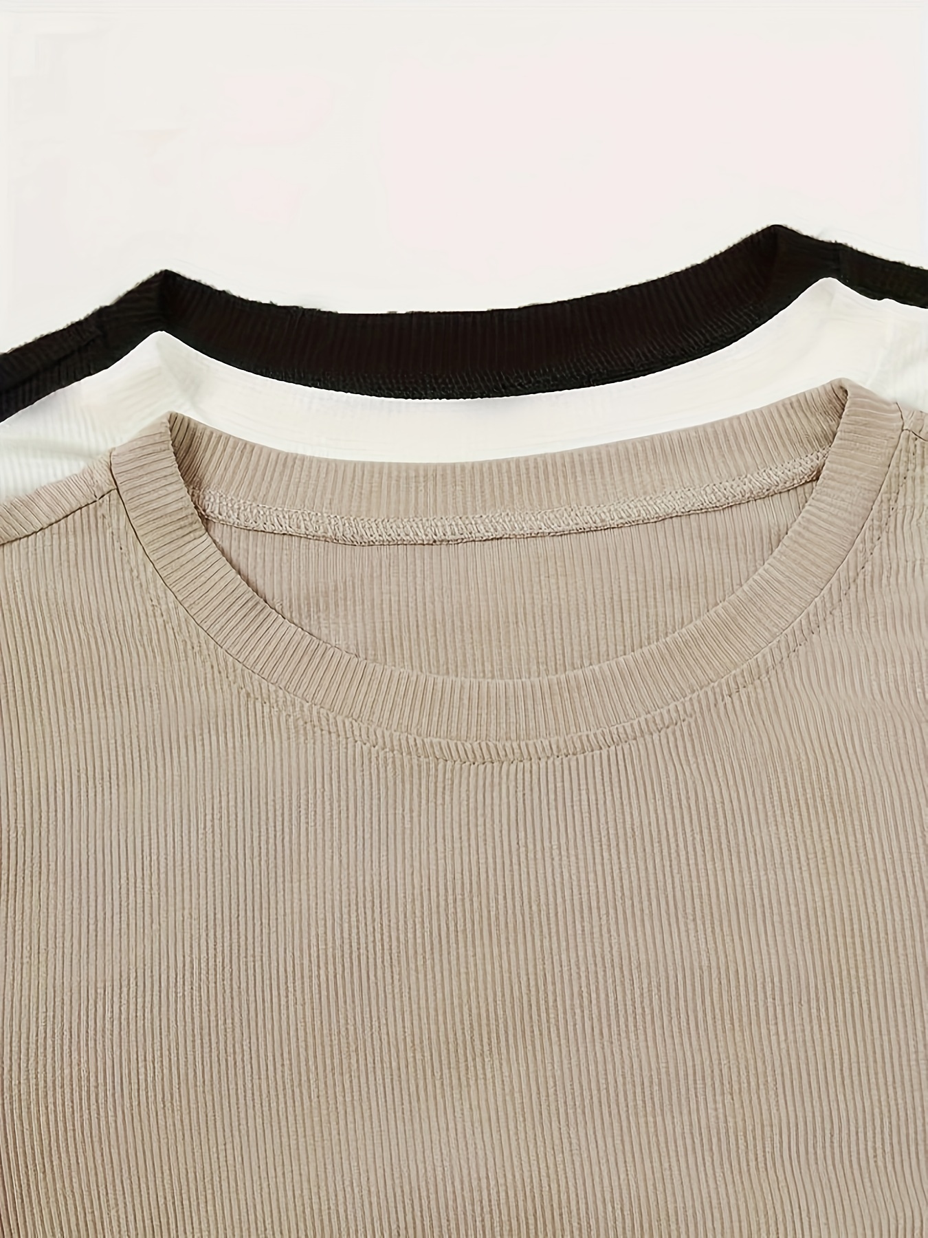 Camiseta manga larga unicolor con cuello redondo y botones delanteros