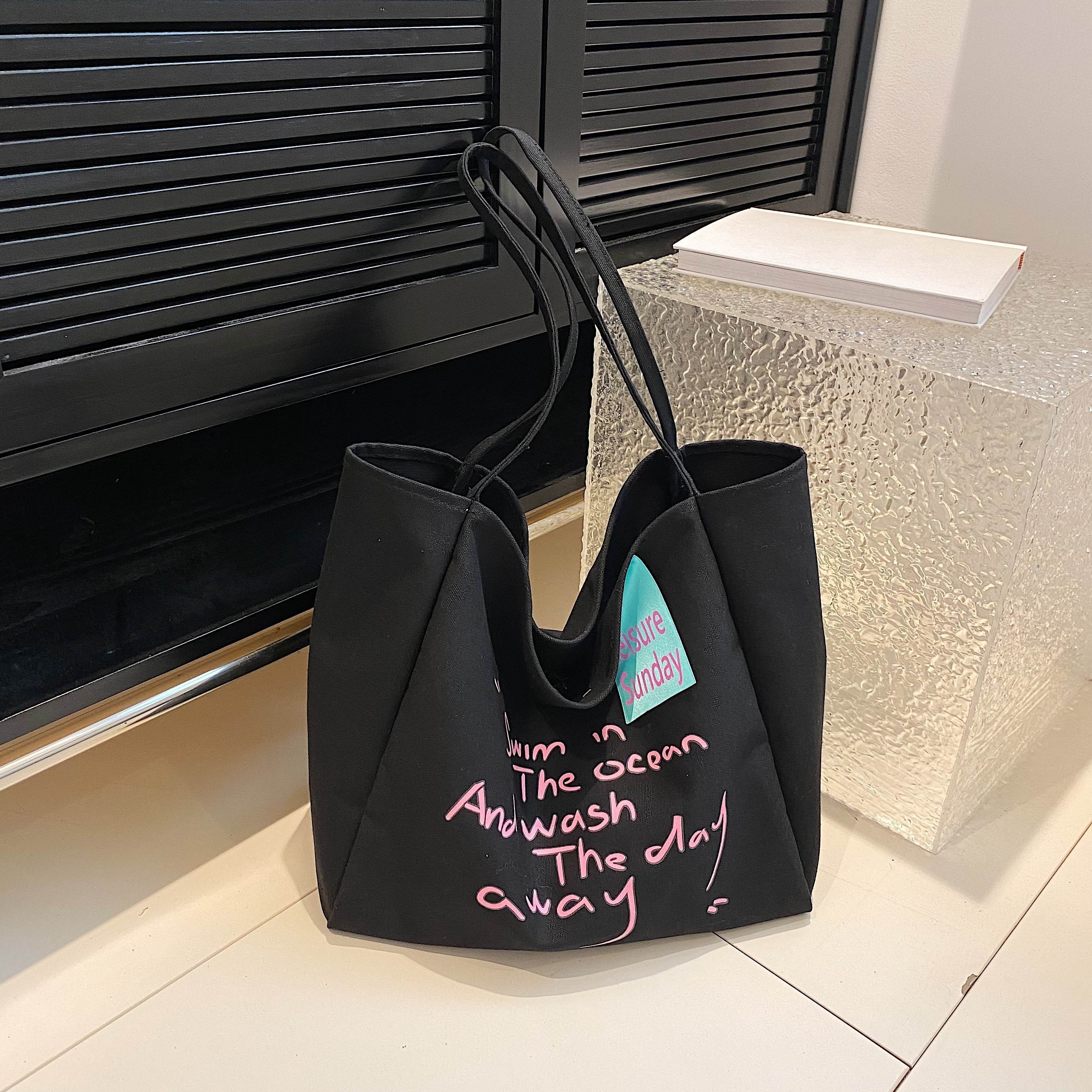 Kwani Asymmetrical Knot Bucket Bag