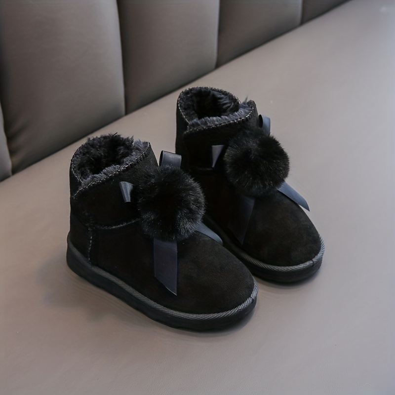 Ugg boots with hot sale fuzzy balls