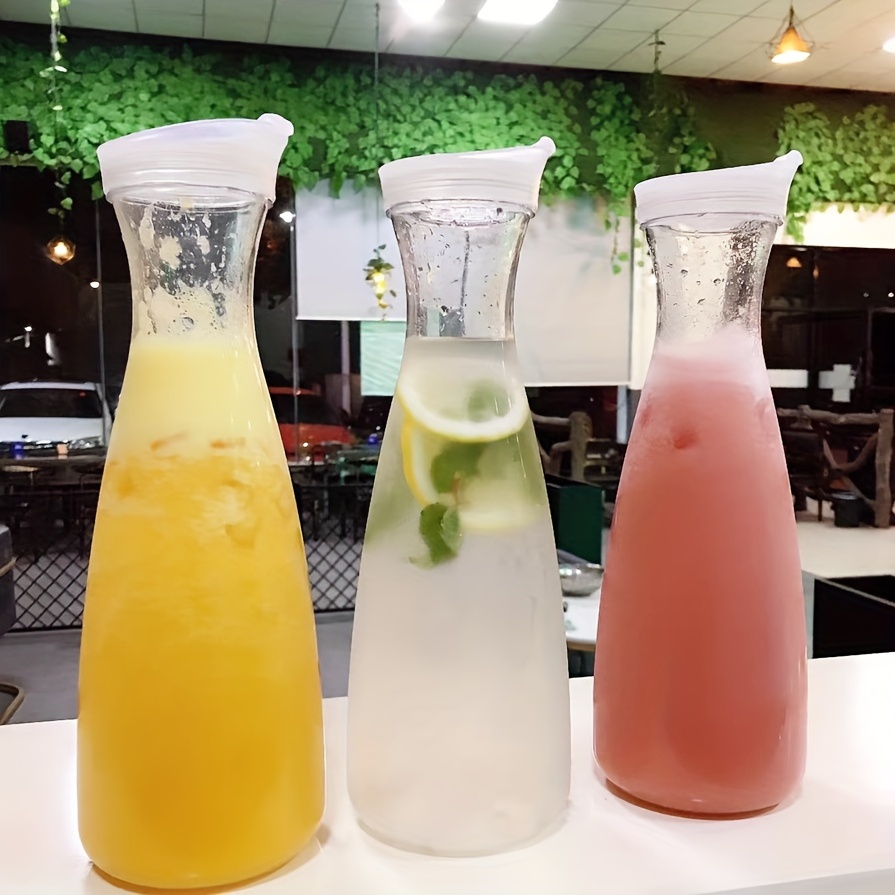 12 Packs Plastic Carafe with Lids 34 oz Clear Mimosa Juice Containers  Acrylic Beverage Carafe Pitcher Drink Containers for Fridge Outdoor Iced  Tea