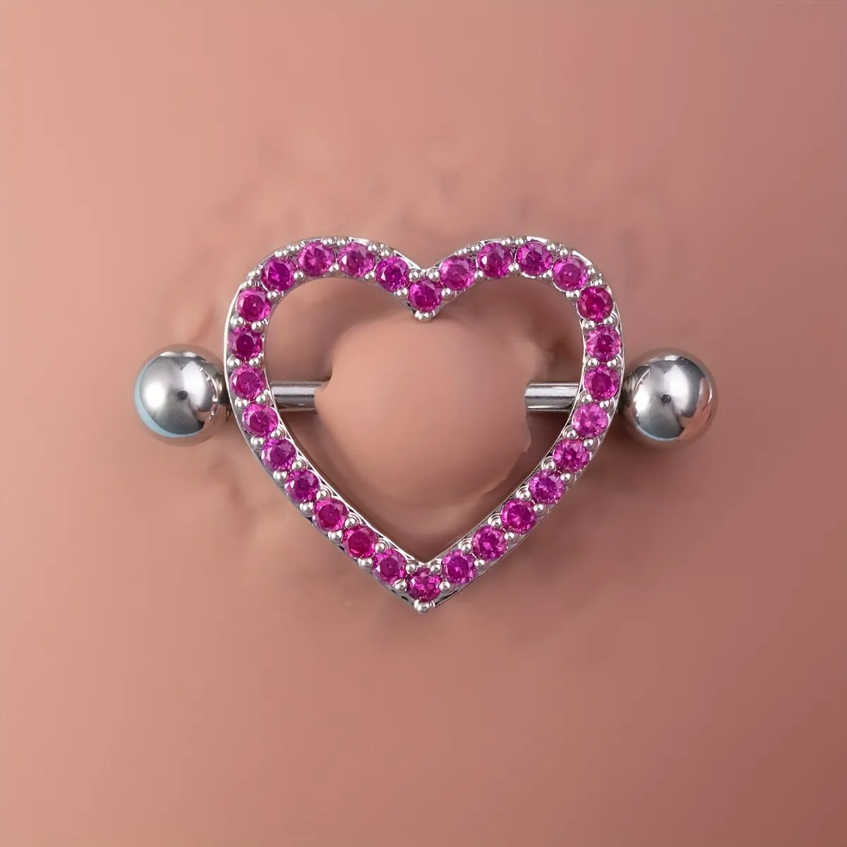 heart nipple piercings on someone