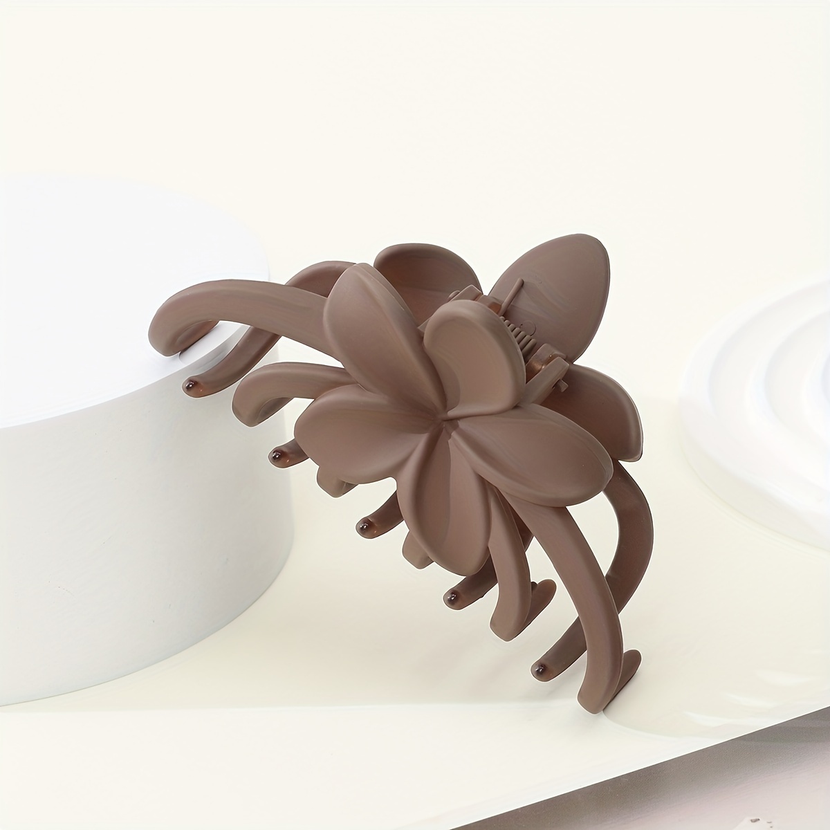 A Large Matte Solid Color Flower Hair Clip For Women