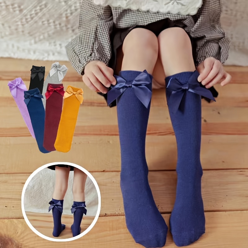 Par de calcetines altos para niña