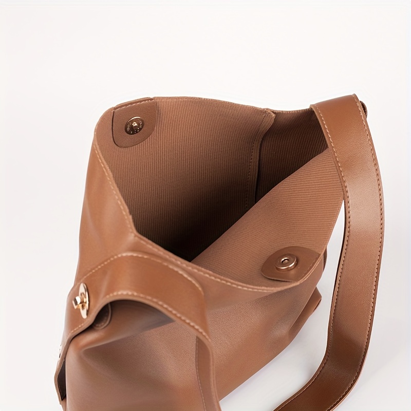 Brown minimalist leather purse with adjustable strap