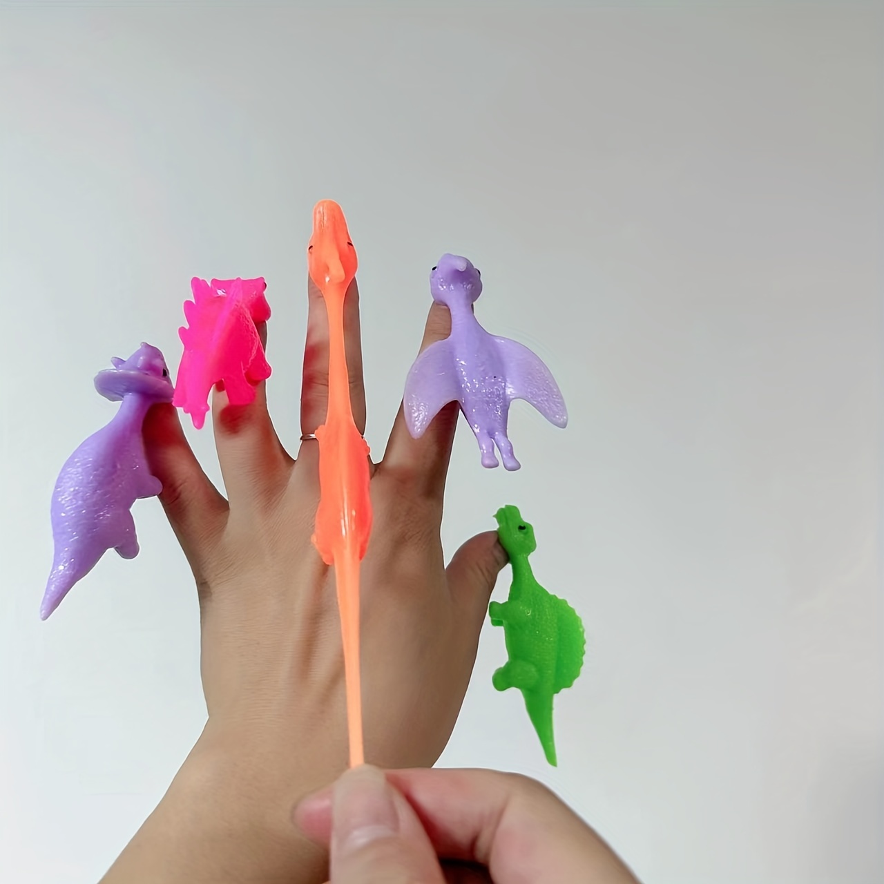 Tpr Material Elastic Dinosaur Finger Slingshot Decompression Creative Toy  Vent Fun Sticky Wall - Temu United Arab Emirates