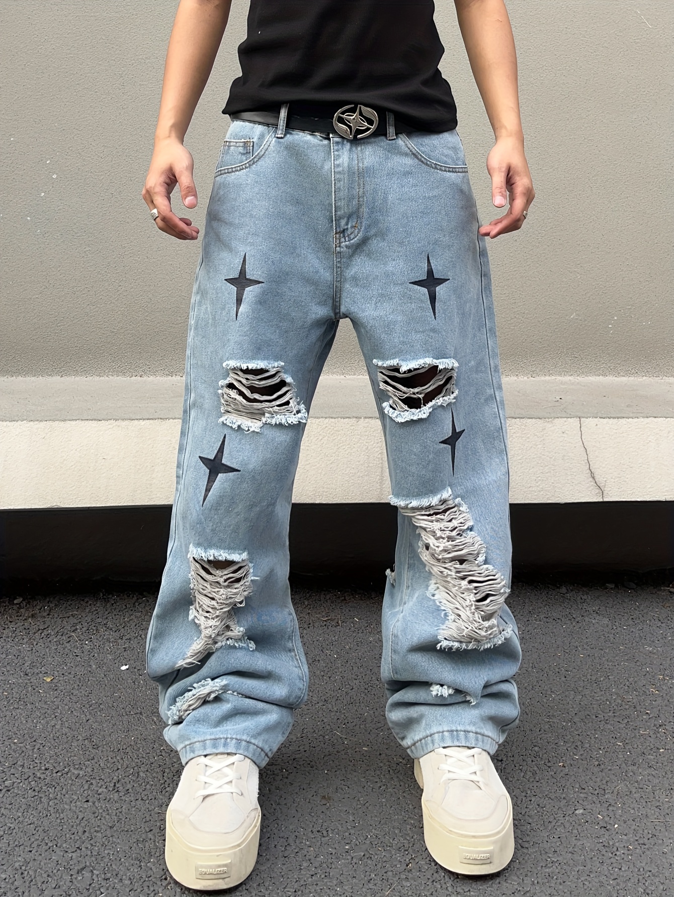 Jeans larghi strappati on sale uomo