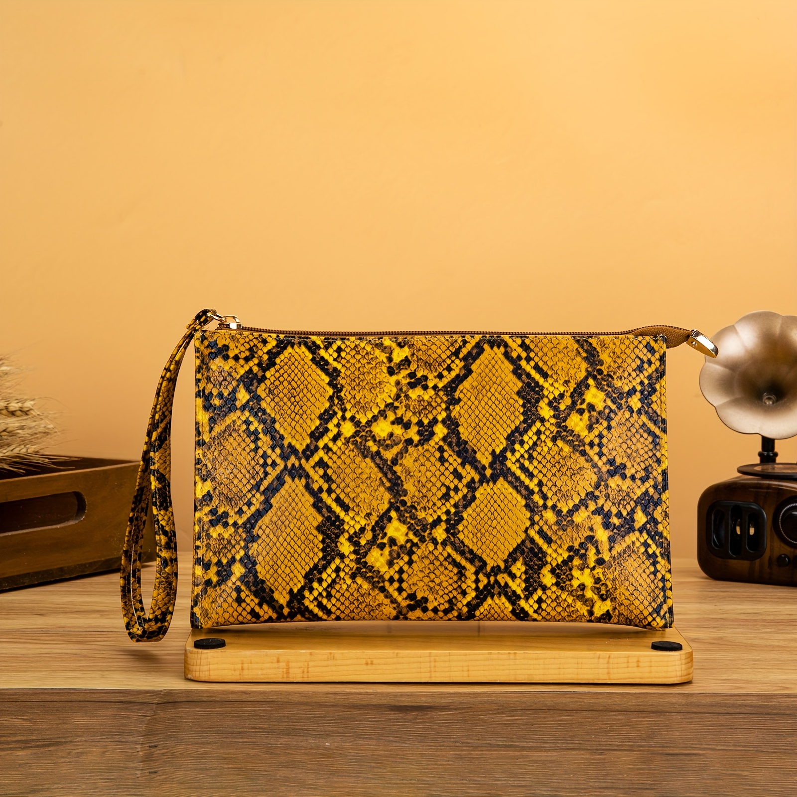 Snake print clutch online bag