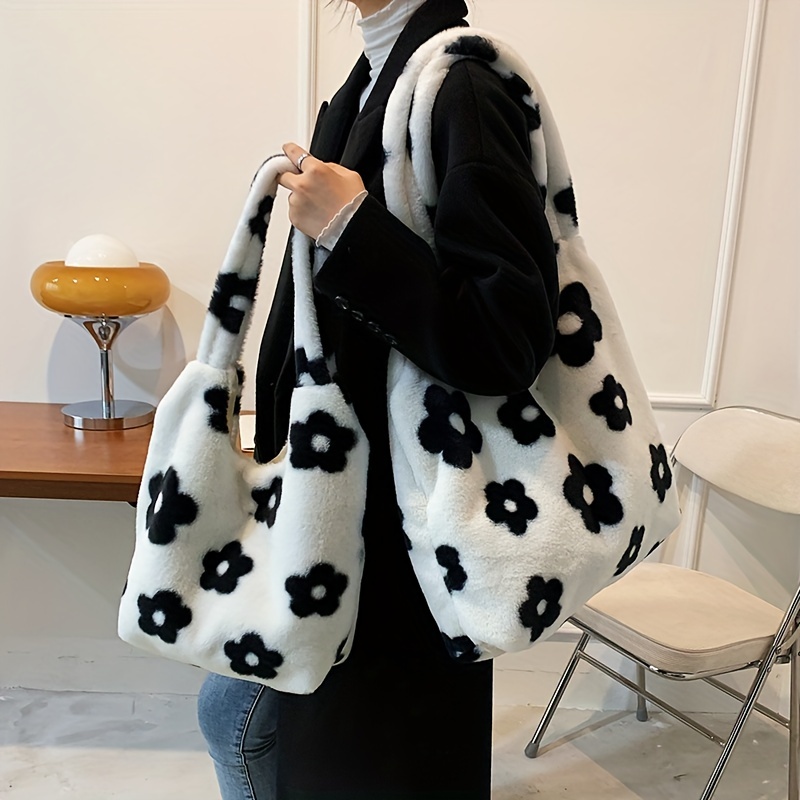 White fuzzy bag with best sale black flowers