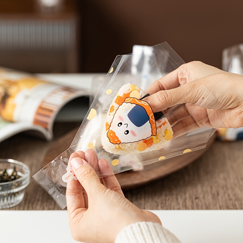 

50pcs, Japanese Style Triangular Rice Ball Packaging Bag Seaweed Sushi Packing Small Bag Transparent Disposable Can Be Heated And Torn Baking Tools