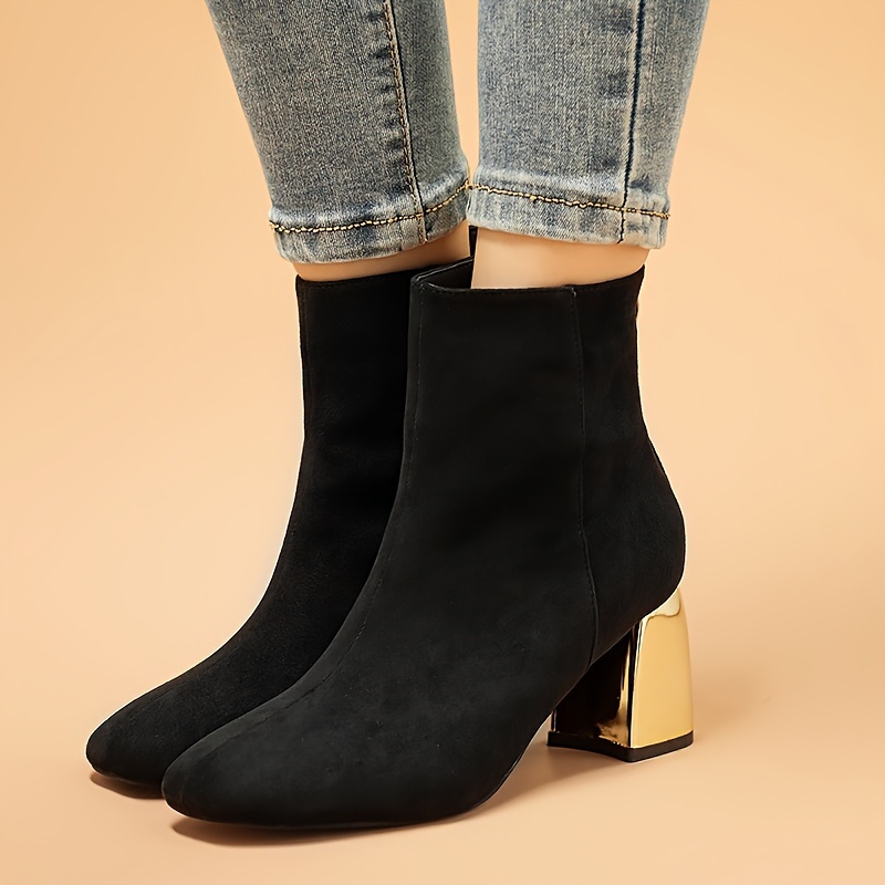 Black boots best sale with gold zipper