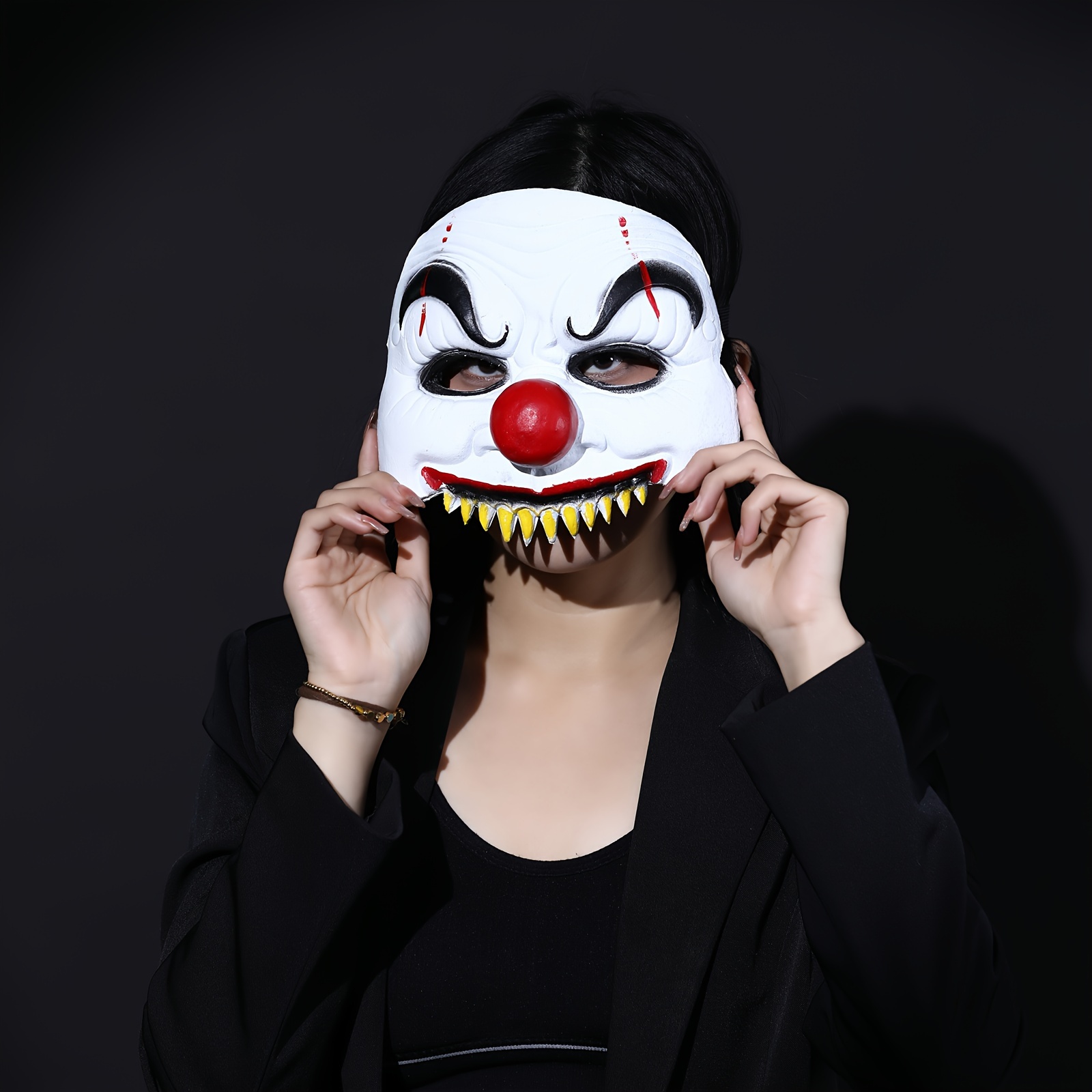 Halloween Makeup Like Pennywise. Street performer clown with a white face.  The look of a man in the guise of IT on a costume cosplay show. Close-up.  Stock Photo