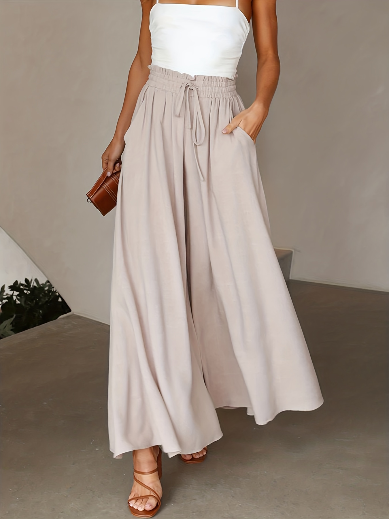 Palazzo pants and a flowy white shirt.