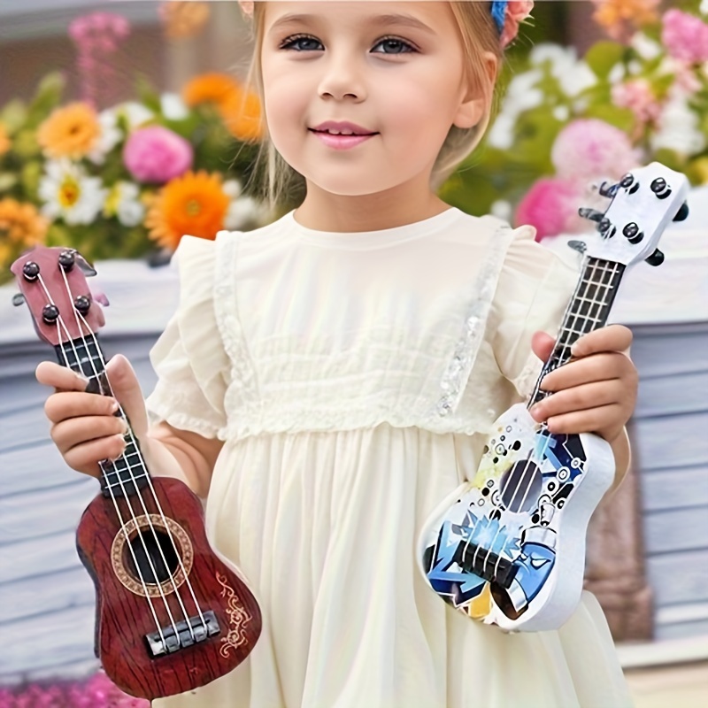 1pcのキッズトイウクレレキッズギターとピックの音楽おもちゃ9.84インチの教育音楽器幼児と幼稚園児のための新年の贈り物