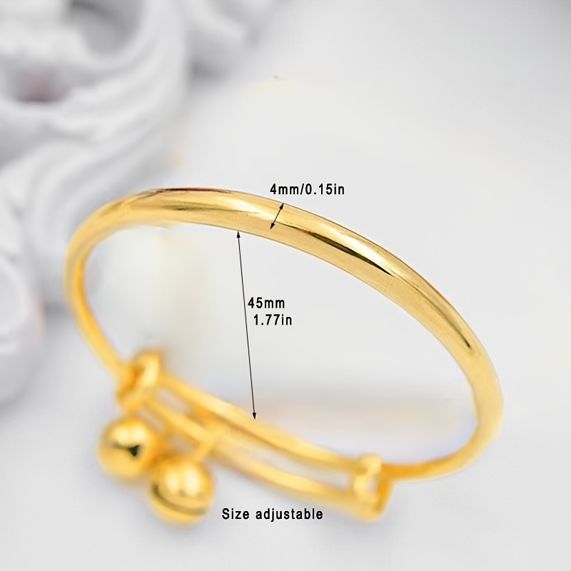 women's gold bracelet on girl's hand, women's accessories, jewelry